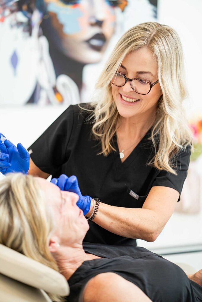 Experienced cosmetic nurse consulting with a patient